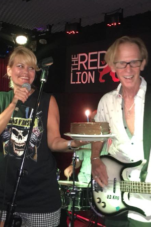 Christine Santelli sings "Happy Birthday" to Mike Muller at Red Lion